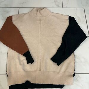 Lush multi colored sweater. Fits like a large but no size tag.